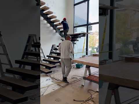 Floating stairs installation. 4” treads, switch back system. #customhome #luxuryhomes