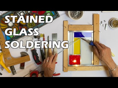 Stained glass soldering tutorial for beginners showing iron technique and bead control