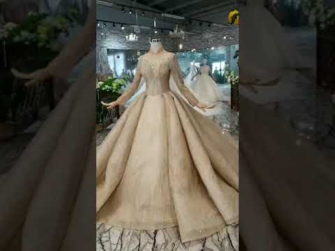 Gold ball gown wedding dress long sleeve sparkly with...