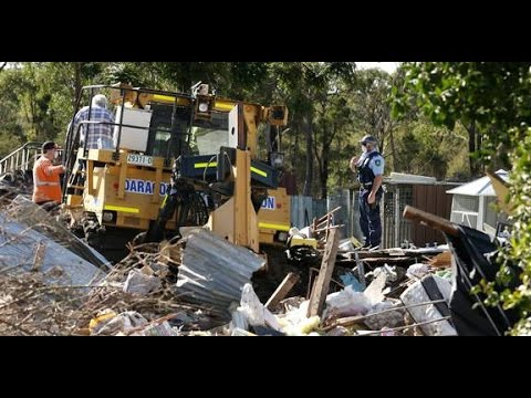 Australia man 'steals bulldozer to crush cars and home'