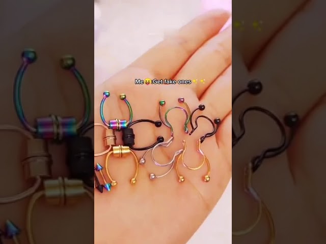 Vídeo relacionado con Hebterrka Juego de 495 Piercings para la Cara, Anillo para la Nariz, Septum y Labio, con Purpurina Facial Adhesiva