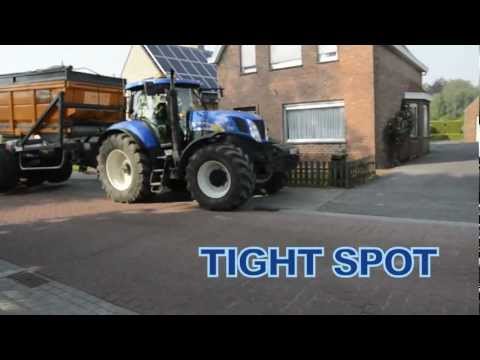 New Holland T7040 and long tridem high decharge Dezeure trailer in a tight spot