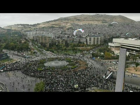 Video | Paragliders fly over Syrians celebrating 1 year since Assad's ouster | AFP