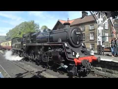 76079 steam locomotive hauled train leaves Grosmont station North Yorks Railway Yorkshire England UK