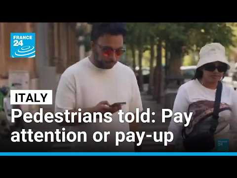 Italy to fine careless pedestrians crossing road while looking at phones
