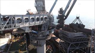 Coal loading on cargo ship at Taboneo anchorage in Indonesia