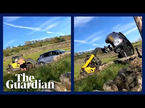 Farmer uses forklift tractor to push and flip car off his land