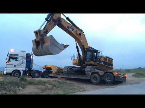 Loading By Side The Caterpillar 385C Excavator