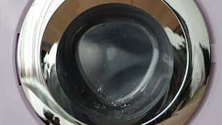 Spinning Miele (toy) washing machine with water