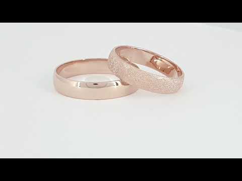 A video of A 14k Rose Gold Classic Wedding Ring Slightly Rounded