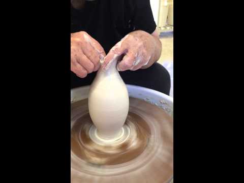 Wheel throwing a narrow necked bottle form with Marsha Silverman.