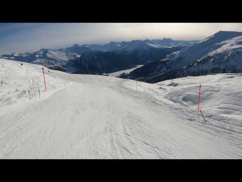 Skiing downhill from Davos Gotschna slope 43, the best view down to the Davos lake and valley