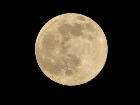 FULL MOON AT 5.02 P.M. HAND HELD FILMING IN HAILSHAM, E.SUSSEX, ENGLAND.