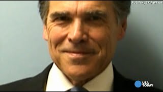 Rick Perry smiles in mug shot, then goes for ice cream