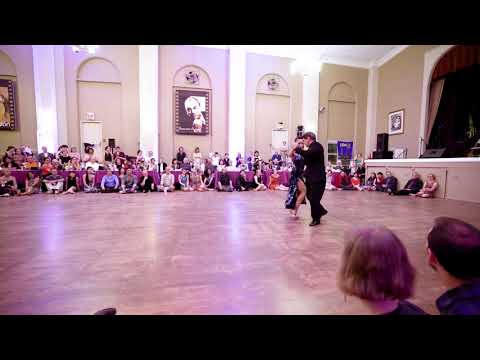  Alejandra Hobert  and  Adrian Veredice  are  dancing  to  the  tango  "  Oro Y Gris  "  at  Philly Tango Fest  in  2019