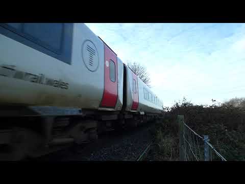 Afternoon Transport for Wales train ex Holyhead passes Flint marsh Flintshire Wales UK 1.2.21