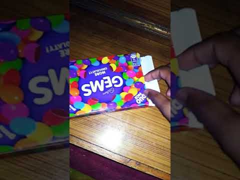 Unboxing the packet of Cadbury gems