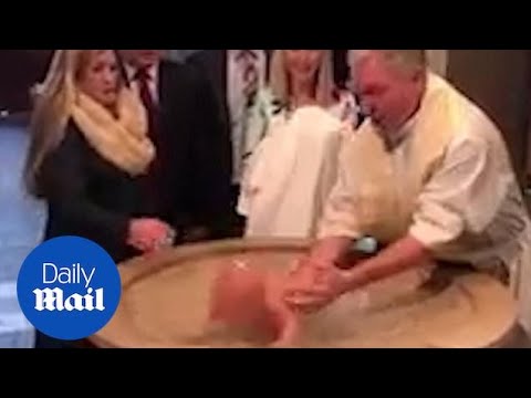 Baptism goes wrong as baby FACEPLANTS into the water!