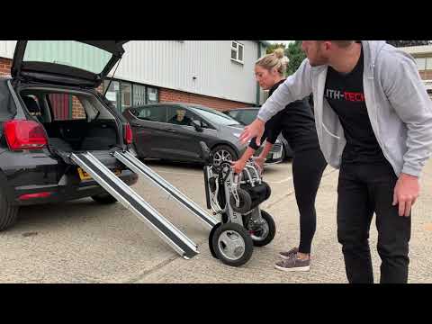 How to get an electric folding wheelchair into a car boot, using LITH-TECH telescopic ramps.