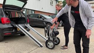 How to get an electric folding wheelchair into a car boot, using LITH-TECH telescopic ramps.