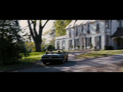 Trailer frame: India in the hallway as the score’s tremolo strings shade to silence