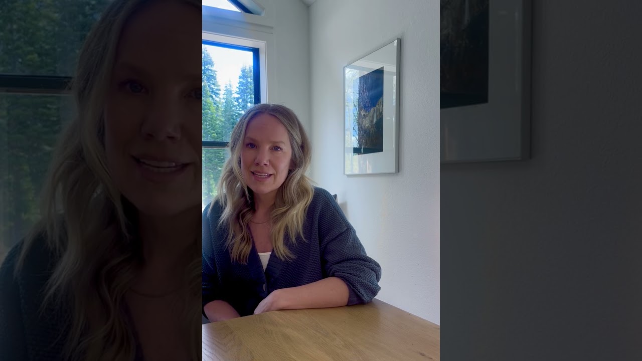 Lisa Fligor, registered dietitian at Tahoe Forest Health System, sitting at a table with a window behind her