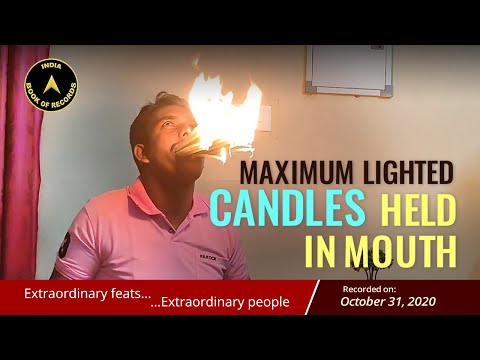 MAXIMUM LIGHTED CANDLES HELD IN MOUTH
