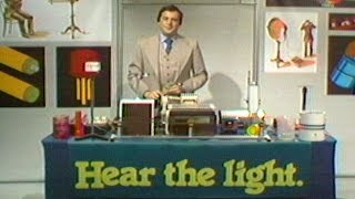 Bell Labs' Henry Weinberg Demonstrates Ways of Using Light to Transmit Sound Waves, 1978