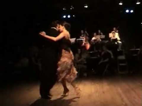  Katia Rodrigues  and  Alexandre Bellarosa  are  dancing  to  the  milonga  "  La Milonga De Buenos Aires  "