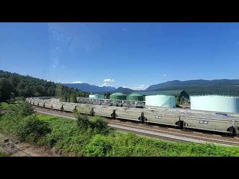 Vancouver SkyTrain - Millenium Line Passing Tanker Cars and Big Sulfur Pit