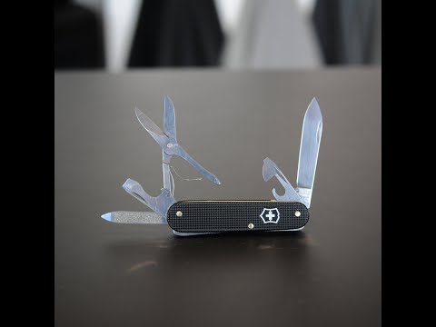 Action of a black Victorinox Cadet X with 91mm Scissors