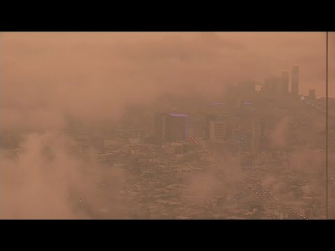 Orange sky blankets San Francisco while fires burn