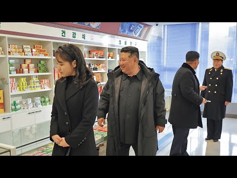 Ju-ae walks ahead of Kim Jong-un