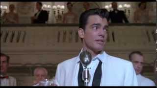 Peter Gallagher singing in The Hudsucker Proxy (1994)