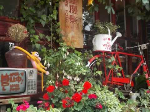 A canção dos bateristas de Lijiang: Um momento - 小倩