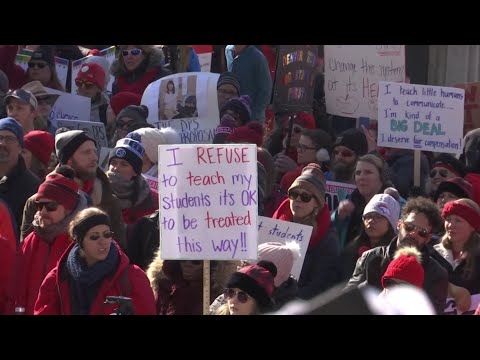 Striking teachers picketed outside of schools and marched through Denver’s streets as car horns blared in support. More than 2,100 of about 4,000 teachers called in absent in Denver’s first strike in 25 years. (Feb. 11)