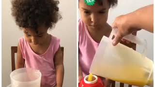 Aluna Larissa do Grupo 2, aprendendo a importância da água e a cor vermelha