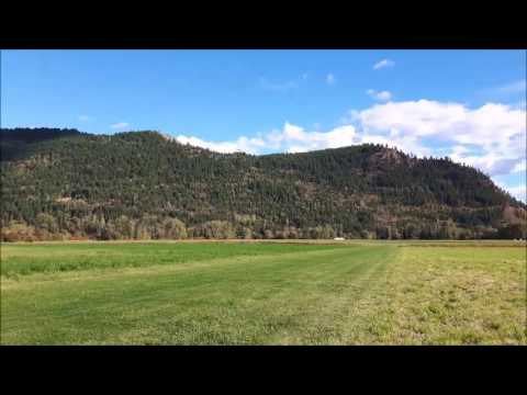 Ground Perspective of a Tandem Hang Glider Landing