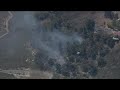 Firefighters battle brush fire burning in Oceanside near 2800 Industry Street