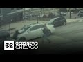 Thief clings to hood of car during Near North Side police chase