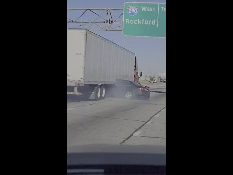 , title : 'Video shows semi-truck dragging vehicle on I-294 with driver still inside'