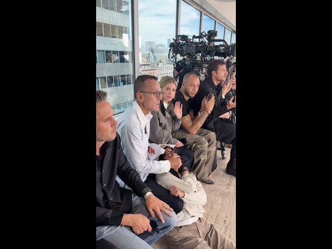 PETA protester restrained by fashion CEO