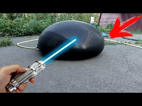 CAN ONE BURN A HUGE WATER BALLOON WITH A POWERFUL LASER?!? Video