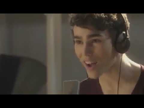 Rags 2012 trailer still — Charlie (Max Schneider) and Kadee (Keke Palmer) in the glow of a studio, setting up the soundtrack’s pop-R&B arc