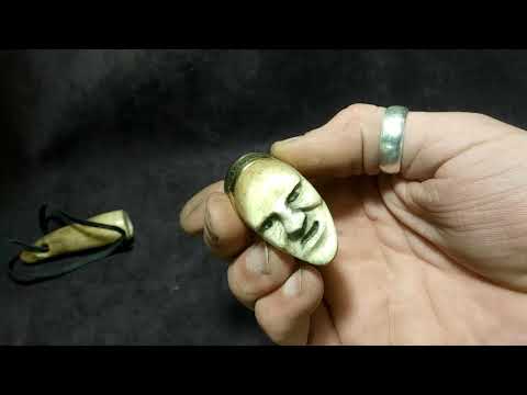 trinket carved from the elk horn(netsuke) bone