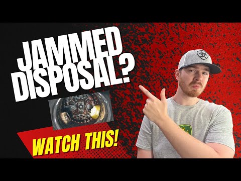 How to fix a garbage disposal that is humming but not spinning