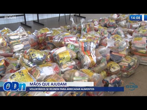 VoluntaÌrios do projeto MaÌƒos que Ajudam se reuÌnem para arrecadar alimentos 24 08 2021
