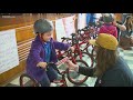 Elementary students celebrate being gifted custom bikes