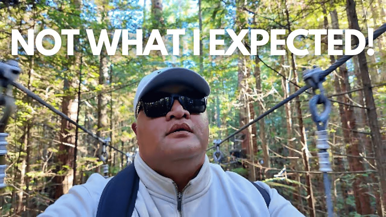 A traveler explores Redwoods Treewalk.