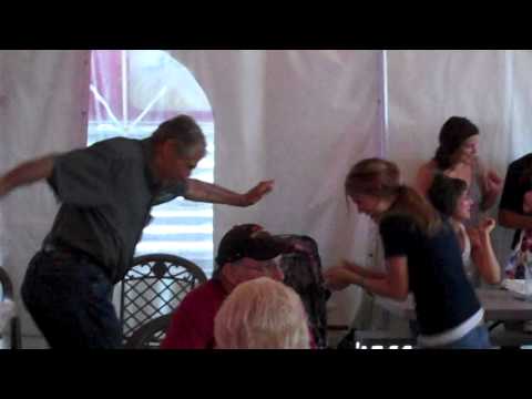 Awesome older guy getting down with one of the Miller Light Girls!!